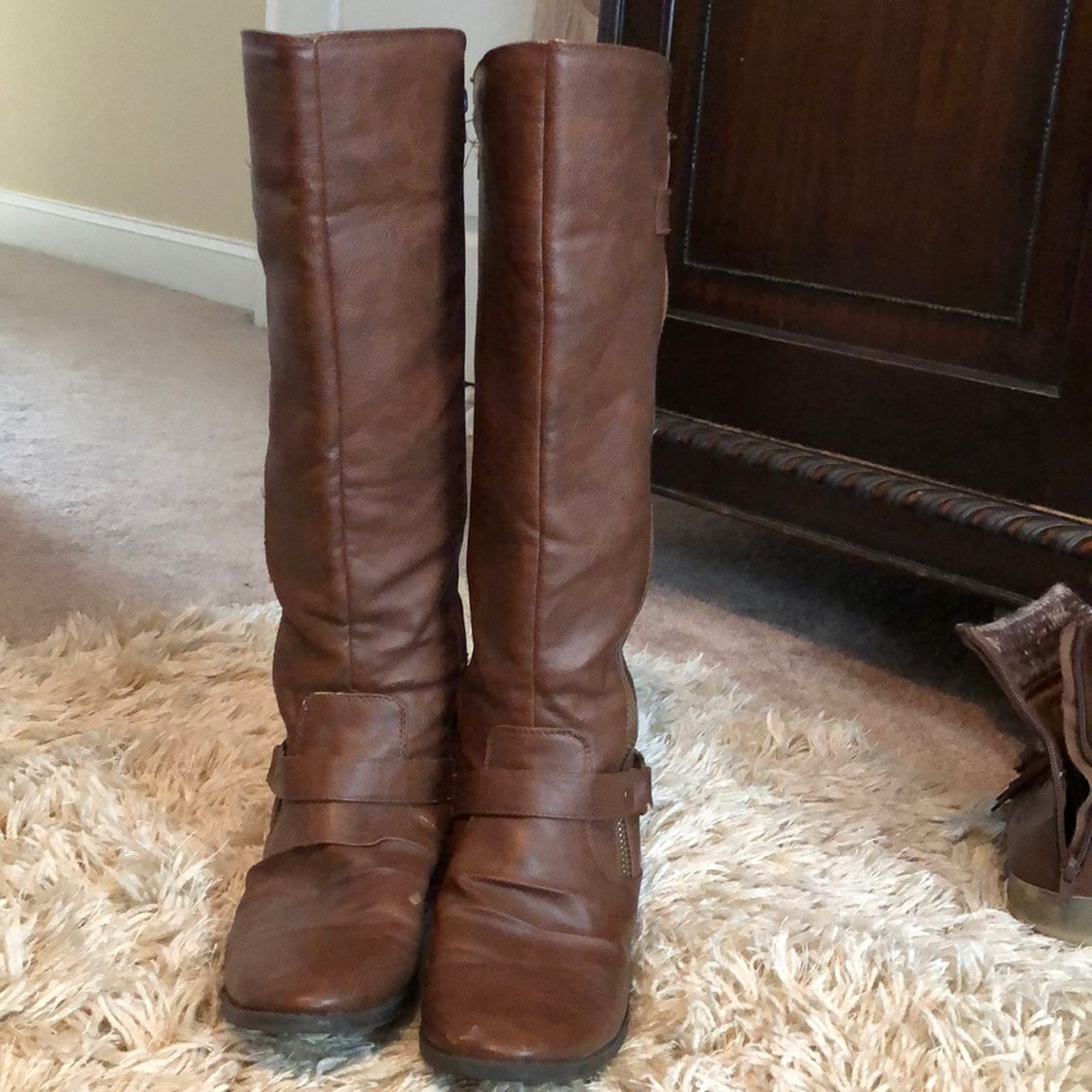 Below the knee, tall brown boots